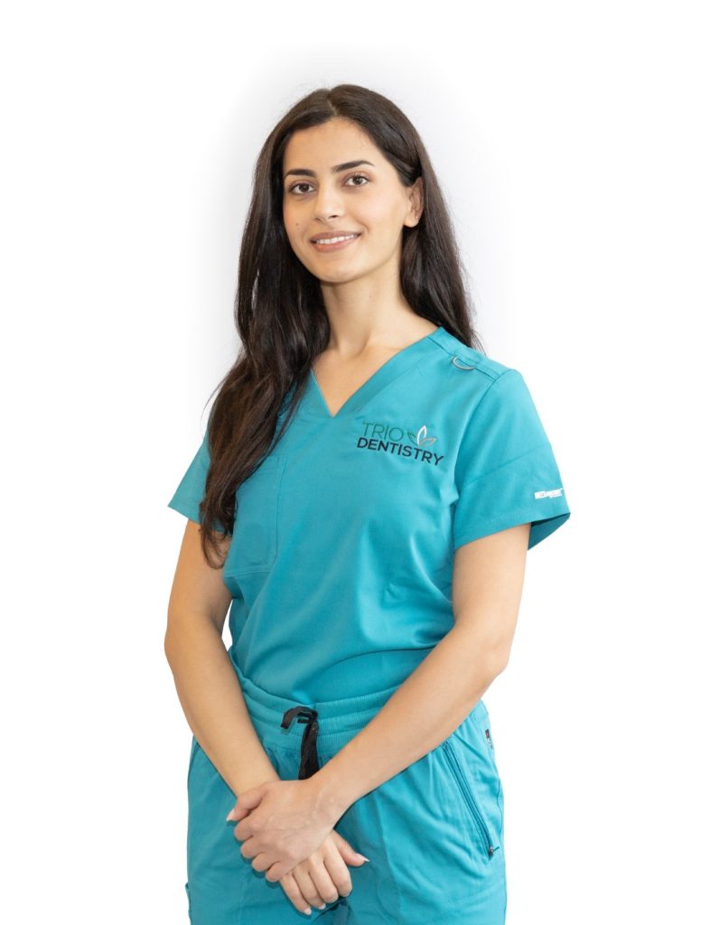 Dental hygienist Randa smiling at the clinic.
